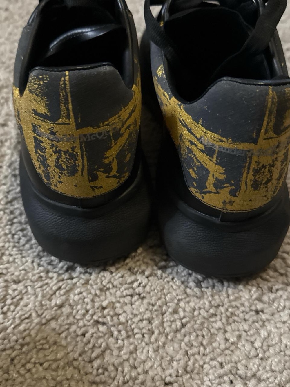 Alexander McQueen Black Sneakers with Distressed Yellow Heel Graphic